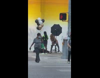 Collab IITW - Woman Dress in Black Leotard Poses in Front of Street Mural 