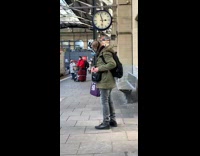 Guy wears face mask over plastic shield 