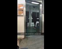 Guy wearing black coat dances on ferry 