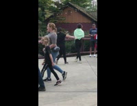 Two women out of sync tiktok dance park