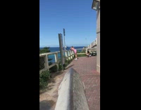 Woman pink outfit legs fence twerk beach Part 1