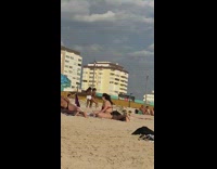 Two girls dance beach sand white shorts