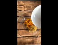 Girl puts together fruit salad with honey 