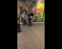 Studded black hat guy one hand guitar 