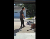 Man with lord Farquaad hairstyle at garage sale 