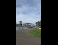 Older guy lays on stomach sunbathes river