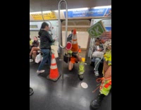 Group of friends dress as traffic cones