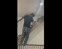 Guy cleans stairs while calling 