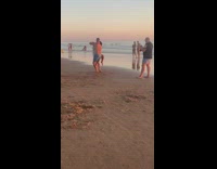 White bikini girl blue shorts guy dance 