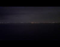 Lightning makes night sky glow tokyo bay