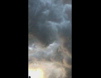 Massive fluffy clouds cover the sky 