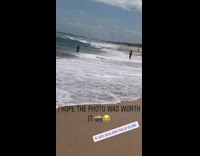 man jumps wave drops him
