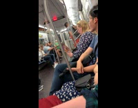 Woman reads book called The Royal Slumber Party to her child on the subway