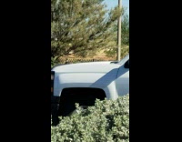 Guy blue jacket sit parking lot fall backwards