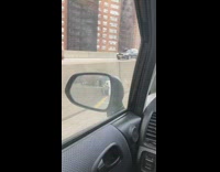 Guy walks on freeway with mattress 