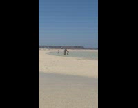 Man and woman tiktok dance tripod beach