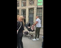 Man stroller baby music video shoot at the protest 