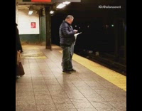 Guy sees a mouse crawling on subway station and chases it