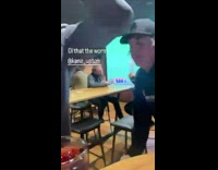 Guy does the worm on a stool 