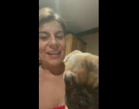 Pug licks womans face 