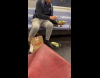 Man picking out vegetables drops them on subway