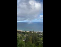 End of rainbow and small isolated rain shower