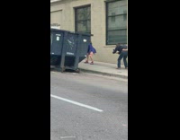 girl blue jacket dance twerk trash can