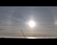 Sun with rainbow reflection halo around it