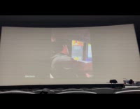 Guys watch internet videos in movie theater