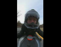 Guy on motorcycle drives on road 