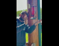 Guy catches hummingbird puts in his mouth and spits it out 