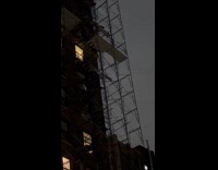 Light fixture falls from building during storm