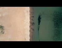 Aerial view of beach water and sand