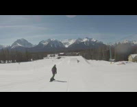 Collab JerrySlams - Snowboarder jumps off ramp and misses the landing, falls on his side