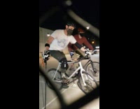 Guys play game while riding bicycles park