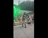 Woman shiny costume poses at the concert