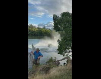 Biker catches air and lands in water 