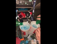 Girl mixes blue powder candy gatorade sprite 