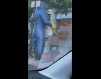 Big blowup rat display on the sidewalk 
