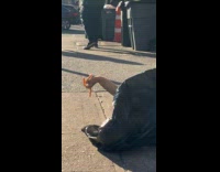 Garbage bag on street with mangled mannequin hand