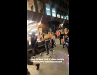 Crowd silent mobile dance party at street