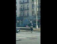 Male Dancer Performs for Cars at Crosswalk 