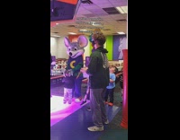 Guy dances with Chuck E. Cheese workers 