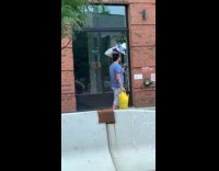 Collab WINY - Man carry sack on head walk street