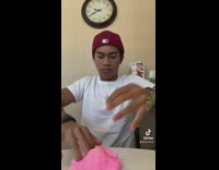 Guy red beanie screams in kitchen and then plays with pink slime 