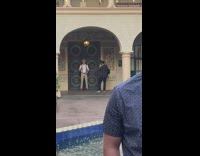 Guy poses for photo by door 