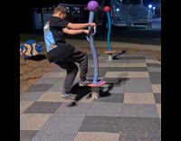 Guy spins around on purple playground toy 