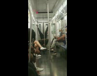 Black shirt guy headstand subway train door 