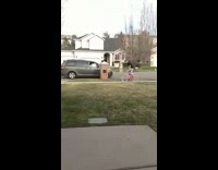 guy doing wheelie on pink bike