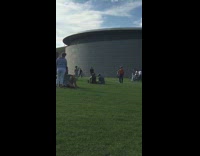 Collab IITW - Man in orange jumps in front of museum